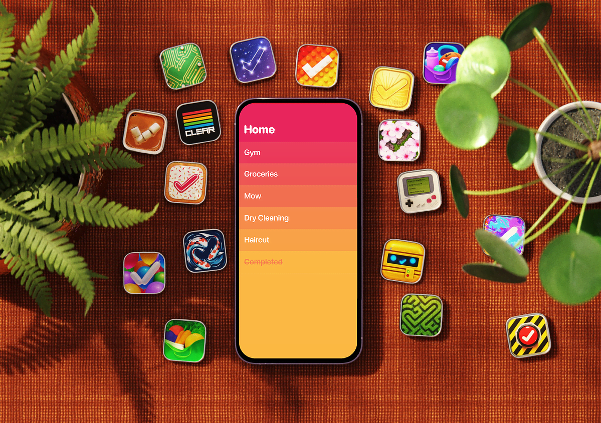 Phone showing the Clear to-do app, surrounded by colorful alternate Clear app icons on an orange rug with houseplants.