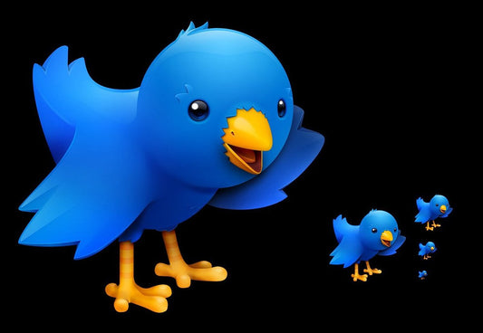 A stylized blue bird character with yellow beak and legs on a black background, with smaller matching bird figures trailing behind it.